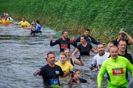 City Riga, Latvia. Run race, people were engaged in sports activities. Overcoming various obstacles and running.  5.07.2020のeditorial素材