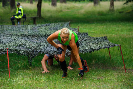 City Riga, Latvia. Run race, people were engaged in sports activities. Overcoming various obstacles and running.  5.07.2020のeditorial素材