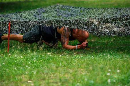 City Riga, Latvia. Run race, people were engaged in sports activities. Overcoming various obstacles and running.  5.07.2020のeditorial素材