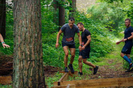 City Riga, Latvia. Run race, people were engaged in sports activities. Overcoming various obstacles and running.  5.07.2020のeditorial素材