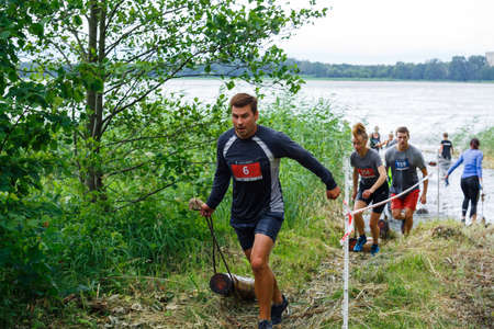 City Riga, Latvia. Run race, people were engaged in sports activities. Overcoming various obstacles and running.  5.07.2020のeditorial素材