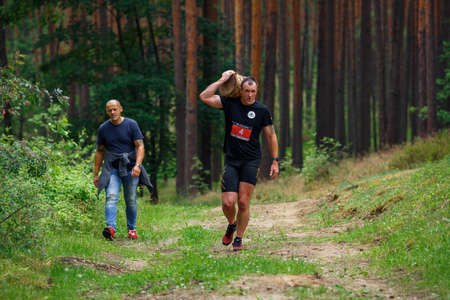 City Riga, Latvia. Run race, people were engaged in sports activities. Overcoming various obstacles and running.  5.07.2020のeditorial素材