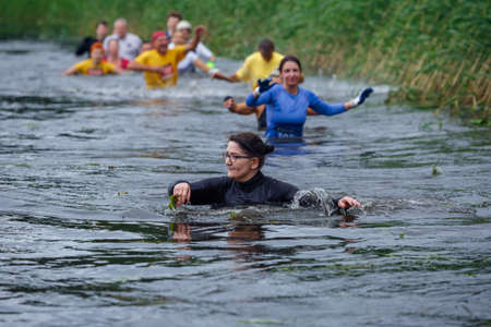 City Riga, Latvia. Run race, people were engaged in sports activities. Overcoming various obstacles and running.  5.07.2020のeditorial素材