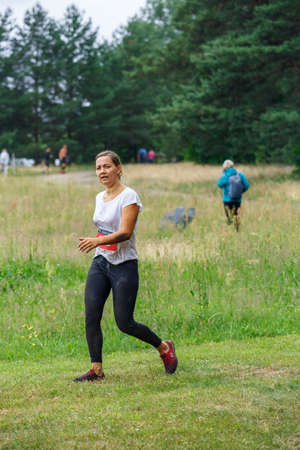 City Riga, Latvia. Run race, people were engaged in sports activities. Overcoming various obstacles and running.  5.07.2020のeditorial素材