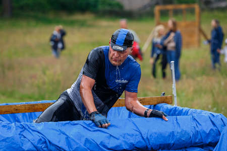 City Riga, Latvia. Run race, people were engaged in sports activities. Overcoming various obstacles and running.  5.07.2020のeditorial素材