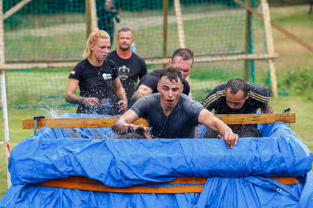 City Riga, Latvia. Run race, people were engaged in sports activities. Overcoming various obstacles and running.  5.07.2020のeditorial素材