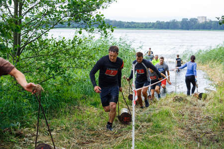 City Riga, Latvia. Run race, people were engaged in sports activities. Overcoming various obstacles and running.  5.07.2020のeditorial素材