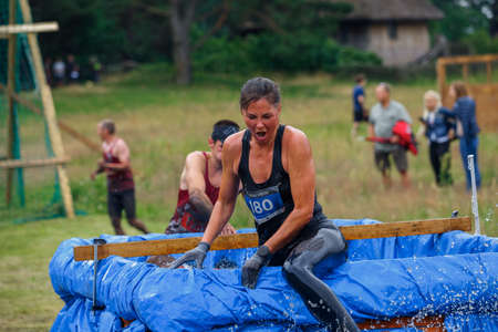 City Riga, Latvia. Run race, people were engaged in sports activities. Overcoming various obstacles and running.  5.07.2020のeditorial素材