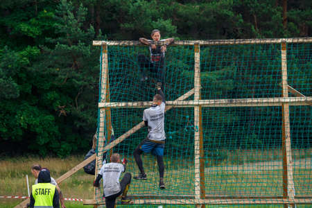 City Riga, Latvia. Run race, people were engaged in sports activities. Overcoming various obstacles and running.  5.07.2020のeditorial素材