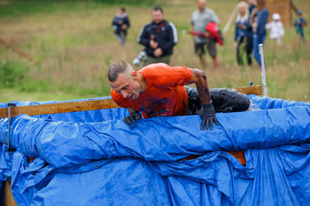 City Riga, Latvia. Run race, people were engaged in sports activities. Overcoming various obstacles and running.  5.07.2020のeditorial素材