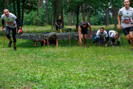 City Riga, Latvia. Run race, people were engaged in sports activities. Overcoming various obstacles and running.  5.07.2020のeditorial素材