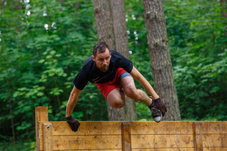 City Riga, Latvia. Run race, people were engaged in sports activities. Overcoming various obstacles and running.  5.07.2020のeditorial素材