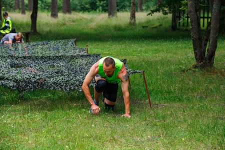 City Riga, Latvia. Run race, people were engaged in sports activities. Overcoming various obstacles and running.  5.07.2020のeditorial素材
