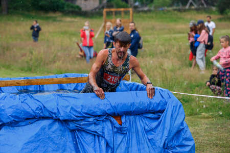 City Riga, Latvia. Run race, people were engaged in sports activities. Overcoming various obstacles and running.  5.07.2020のeditorial素材