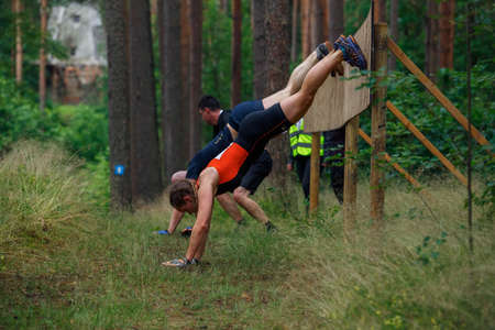 City Riga, Latvia. Run race, people were engaged in sports activities. Overcoming various obstacles and running.  5.07.2020のeditorial素材