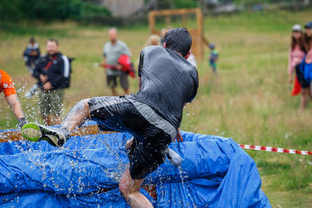 City Riga, Latvia. Run race, people were engaged in sports activities. Overcoming various obstacles and running.  5.07.2020のeditorial素材