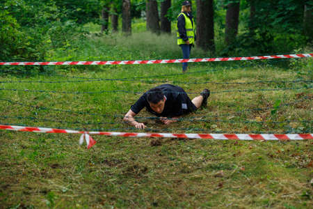City Riga, Latvia. Run race, people were engaged in sports activities. Overcoming various obstacles and running.  5.07.2020のeditorial素材