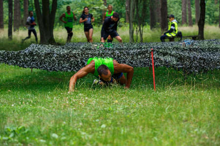 City Riga, Latvia. Run race, people were engaged in sports activities. Overcoming various obstacles and running.  5.07.2020のeditorial素材