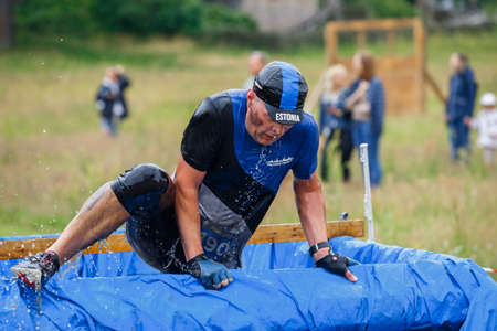 City Riga, Latvia. Run race, people were engaged in sports activities. Overcoming various obstacles and running.  5.07.2020のeditorial素材