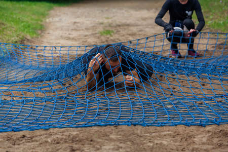 City Riga, Latvia. Run race, people were engaged in sports activities. Overcoming various obstacles and running.  5.07.2020のeditorial素材