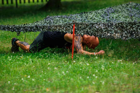 City Riga, Latvia. Run race, people were engaged in sports activities. Overcoming various obstacles and running.  5.07.2020のeditorial素材