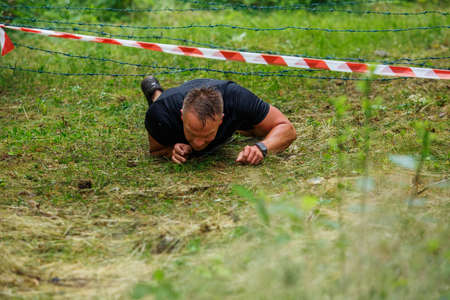 City Riga, Latvia. Run race, people were engaged in sports activities. Overcoming various obstacles and running.  5.07.2020のeditorial素材