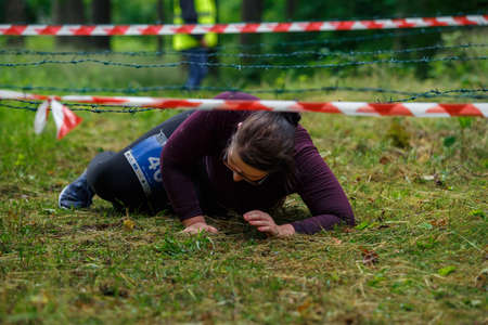City Riga, Latvia. Run race, people were engaged in sports activities. Overcoming various obstacles and running.  5.07.2020のeditorial素材