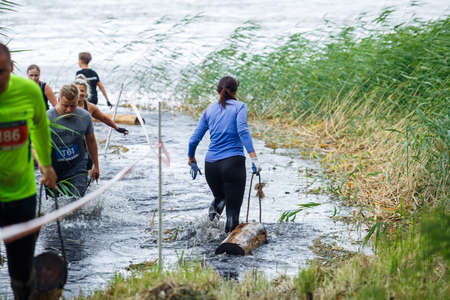 City Riga, Latvia. Run race, people were engaged in sports activities. Overcoming various obstacles and running.  5.07.2020のeditorial素材