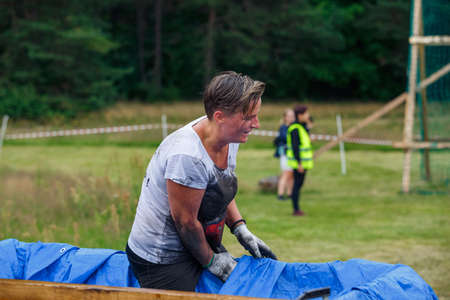 City Riga, Latvia. Run race, people were engaged in sports activities. Overcoming various obstacles and running.  5.07.2020のeditorial素材
