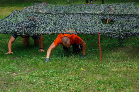 City Riga, Latvia. Run race, people were engaged in sports activities. Overcoming various obstacles and running.  5.07.2020のeditorial素材
