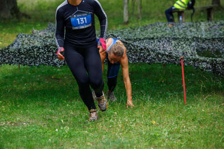 City Riga, Latvia. Run race, people were engaged in sports activities. Overcoming various obstacles and running.  5.07.2020のeditorial素材