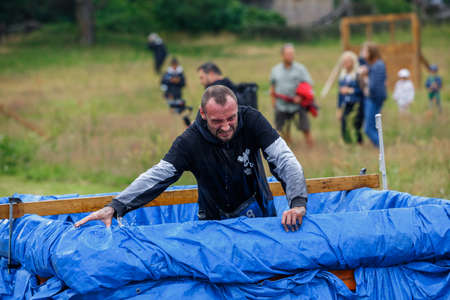 City Riga, Latvia. Run race, people were engaged in sports activities. Overcoming various obstacles and running.  5.07.2020のeditorial素材