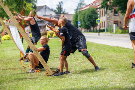 City Plavinas, Latvia. Run race, people were engaged in sports activities. Overcoming various obstacles and running.18.07.2020のeditorial素材
