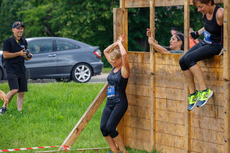 City Plavinas, Latvia. Run race, people were engaged in sports activities. Overcoming various obstacles and running.18.07.2020のeditorial素材