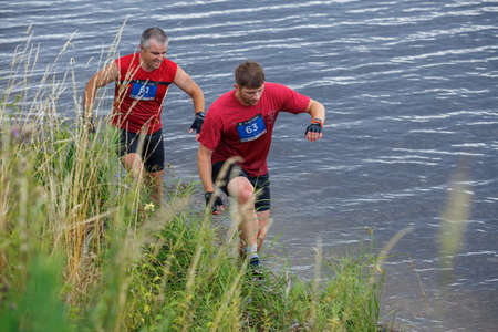 City Plavinas, Latvia. Run race, people were engaged in sports activities. Overcoming various obstacles and running.18.07.2020のeditorial素材