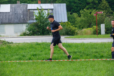 City Plavinas, Latvia. Run race, people were engaged in sports activities. Overcoming various obstacles and running.18.07.2020のeditorial素材