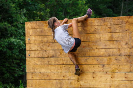 City Plavinas, Latvia. Run race, people were engaged in sports activities. Overcoming various obstacles and running.18.07.2020のeditorial素材