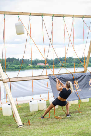 City Plavinas, Latvia. Run race, people were engaged in sports activities. Overcoming various obstacles and running.18.07.2020のeditorial素材