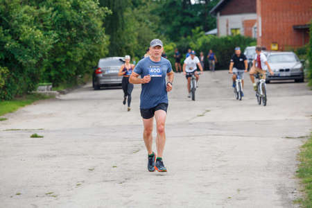 City Plavinas, Latvia. Run race, people were engaged in sports activities. Overcoming various obstacles and running.18.07.2020のeditorial素材
