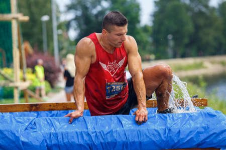 City Plavinas, Latvia. Run race, people were engaged in sports activities. Overcoming various obstacles and running.18.07.2020のeditorial素材