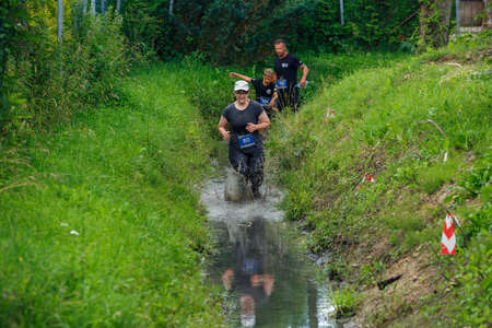City Plavinas, Latvia. Run race, people were engaged in sports activities. Overcoming various obstacles and running.18.07.2020のeditorial素材