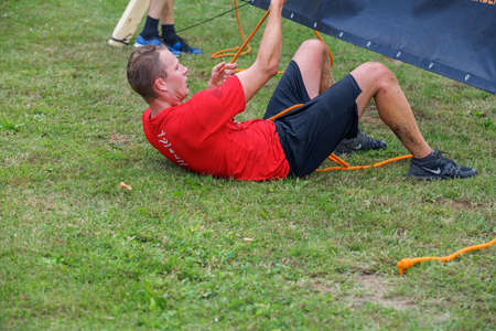 City Plavinas, Latvia. Run race, people were engaged in sports activities. Overcoming various obstacles and running.18.07.2020のeditorial素材