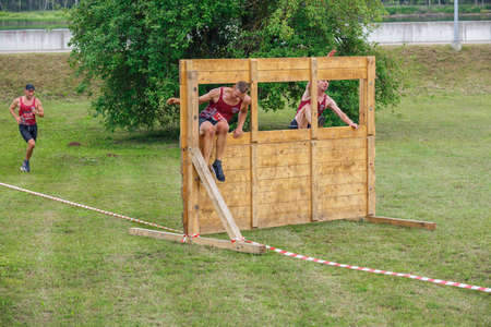 City Plavinas, Latvia. Run race, people were engaged in sports activities. Overcoming various obstacles and running.18.07.2020のeditorial素材