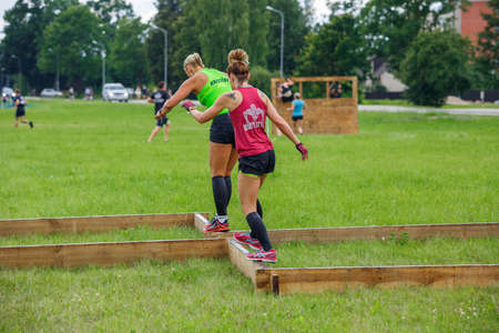 City Plavinas, Latvia. Run race, people were engaged in sports activities. Overcoming various obstacles and running.18.07.2020のeditorial素材