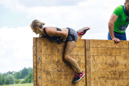 City Plavinas, Latvia. Run race, people were engaged in sports activities. Overcoming various...
