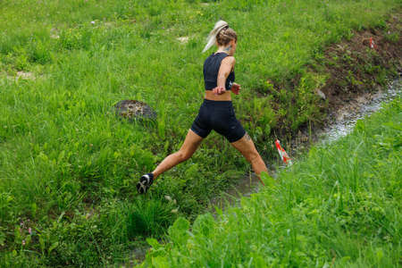 City Plavinas, Latvia. Run race, people were engaged in sports activities. Overcoming various obstacles and running.18.07.2020のeditorial素材