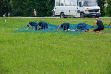 City Plavinas, Latvia. Run race, people were engaged in sports activities. Overcoming various obstacles and running.18.07.2020のeditorial素材