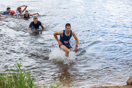 City Plavinas, Latvia. Run race, people were engaged in sports activities. Overcoming various obstacles and running.18.07.2020のeditorial素材