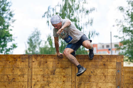 City Plavinas, Latvia. Run race, people were engaged in sports activities. Overcoming various...