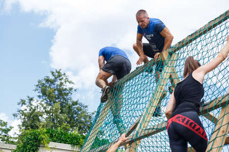 City Plavinas, Latvia. Run race, people were engaged in sports activities. Overcoming various obstacles and running.18.07.2020のeditorial素材